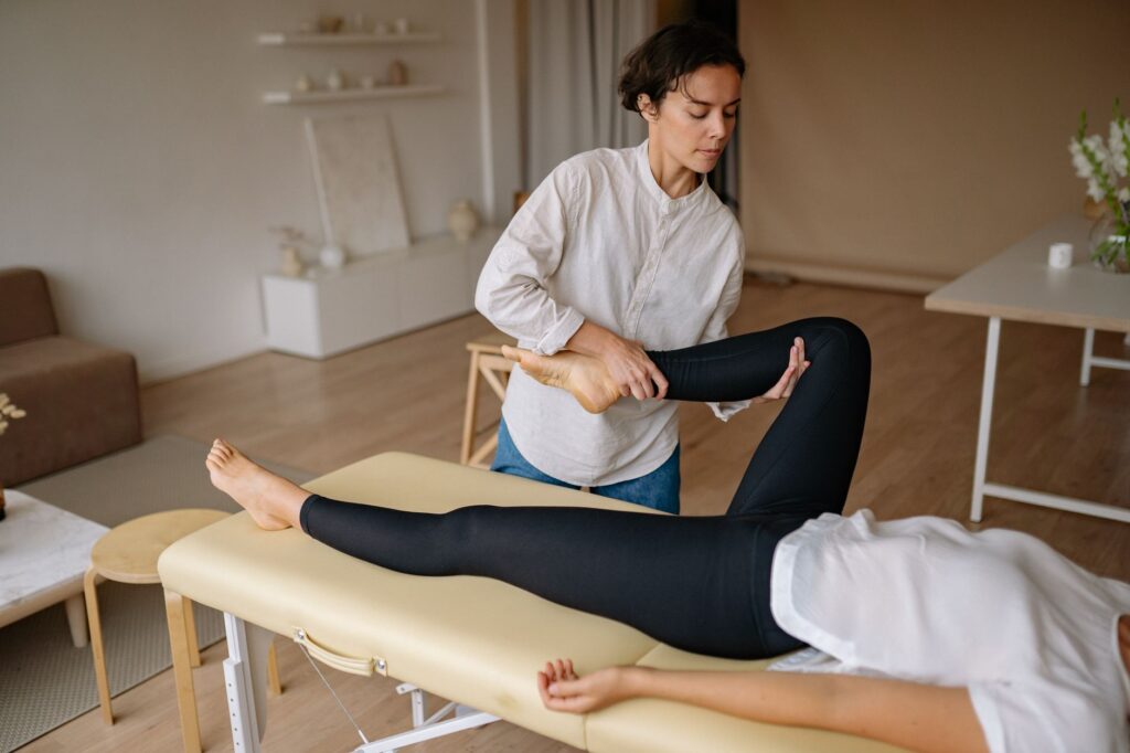 Mobile massage therapist providing treatment at client's home